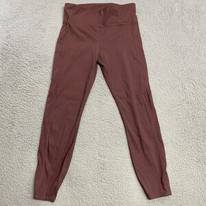 Vuori High Rise Stride Leggings in Chestnut Brown. Women’s size Small